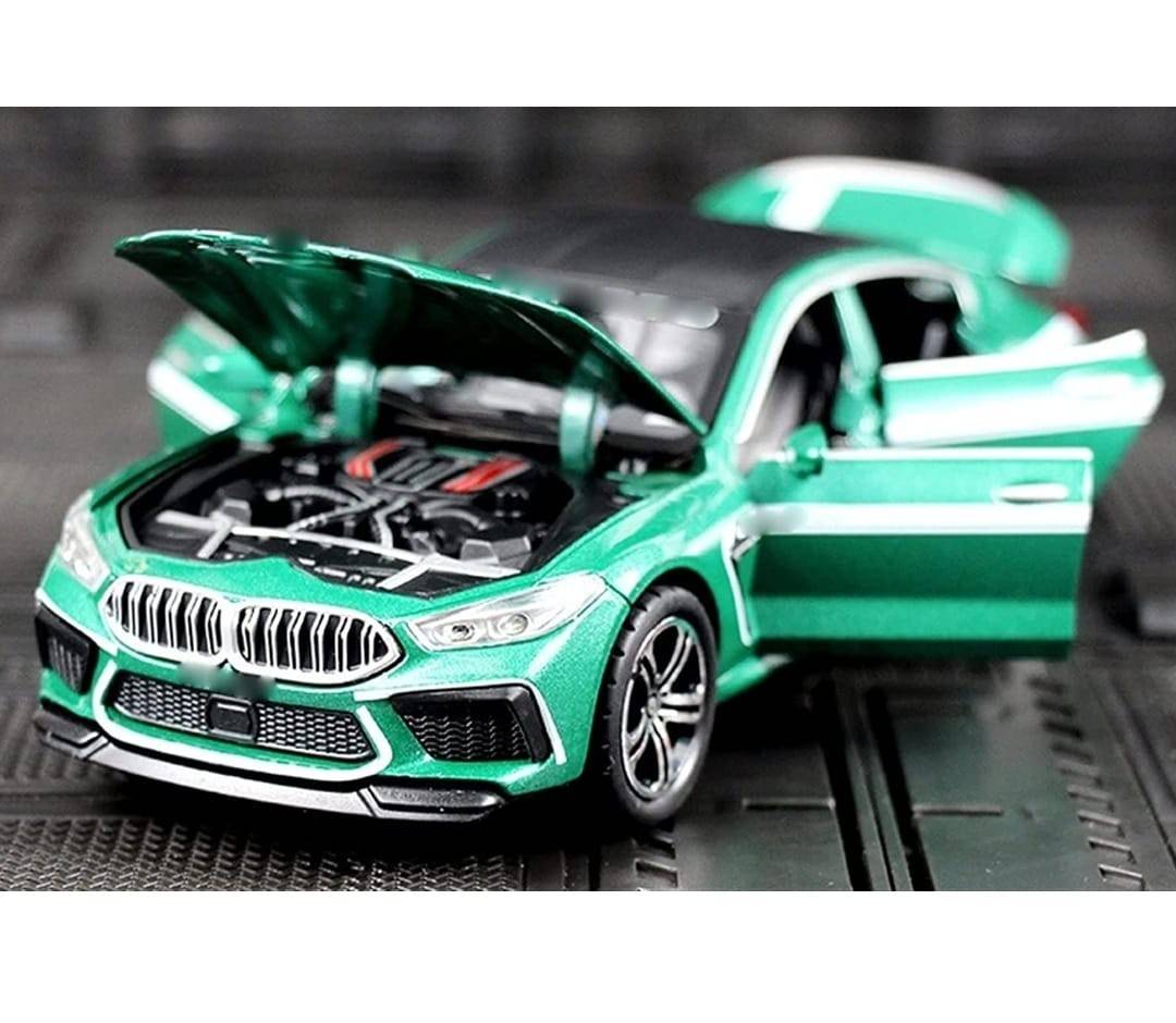 Masinuta metal mecanica, tip BMW M8 MANHART, 3 sunete, usi mobile, capota mobila, portbagaj mobil, verde, 22 cm